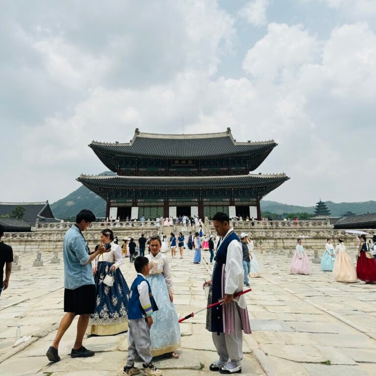 Gyeongbokgung Palace and people with traditional clothes